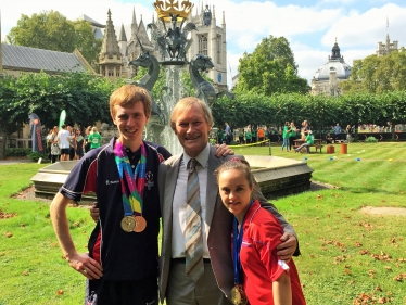 Sir David with Special Olympians, Dan and Charlotte
